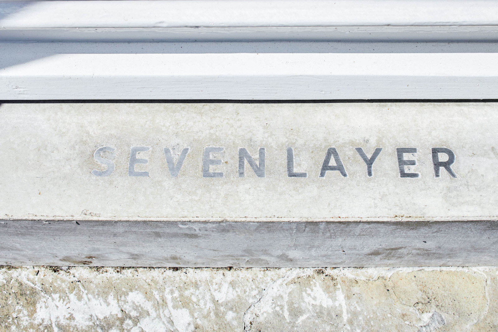 Seven Layer logo embedded into doorstep by BusbyWebb