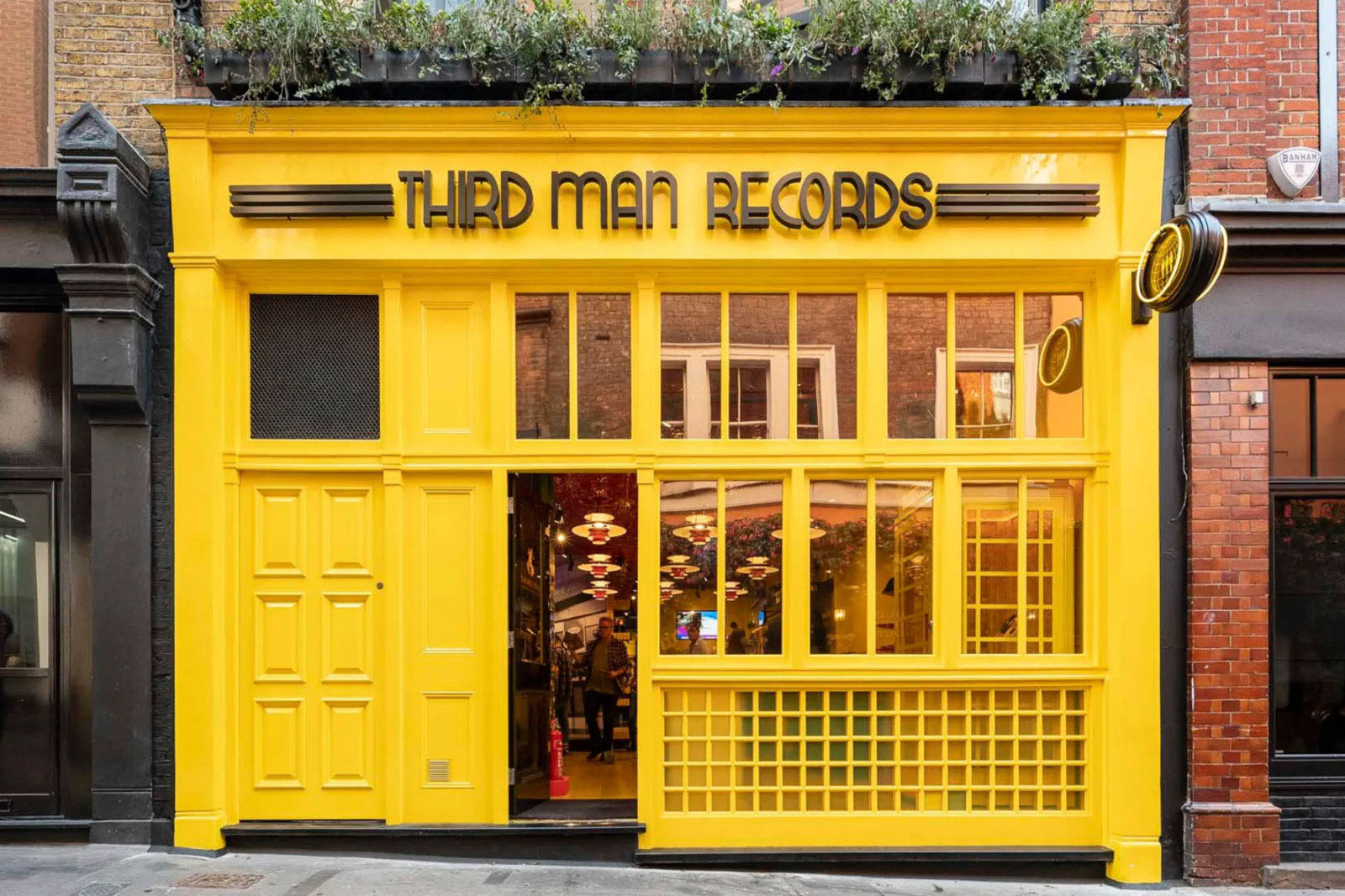 Third Man Records London yellow storefront in Soho, retail design by BusbyWebb